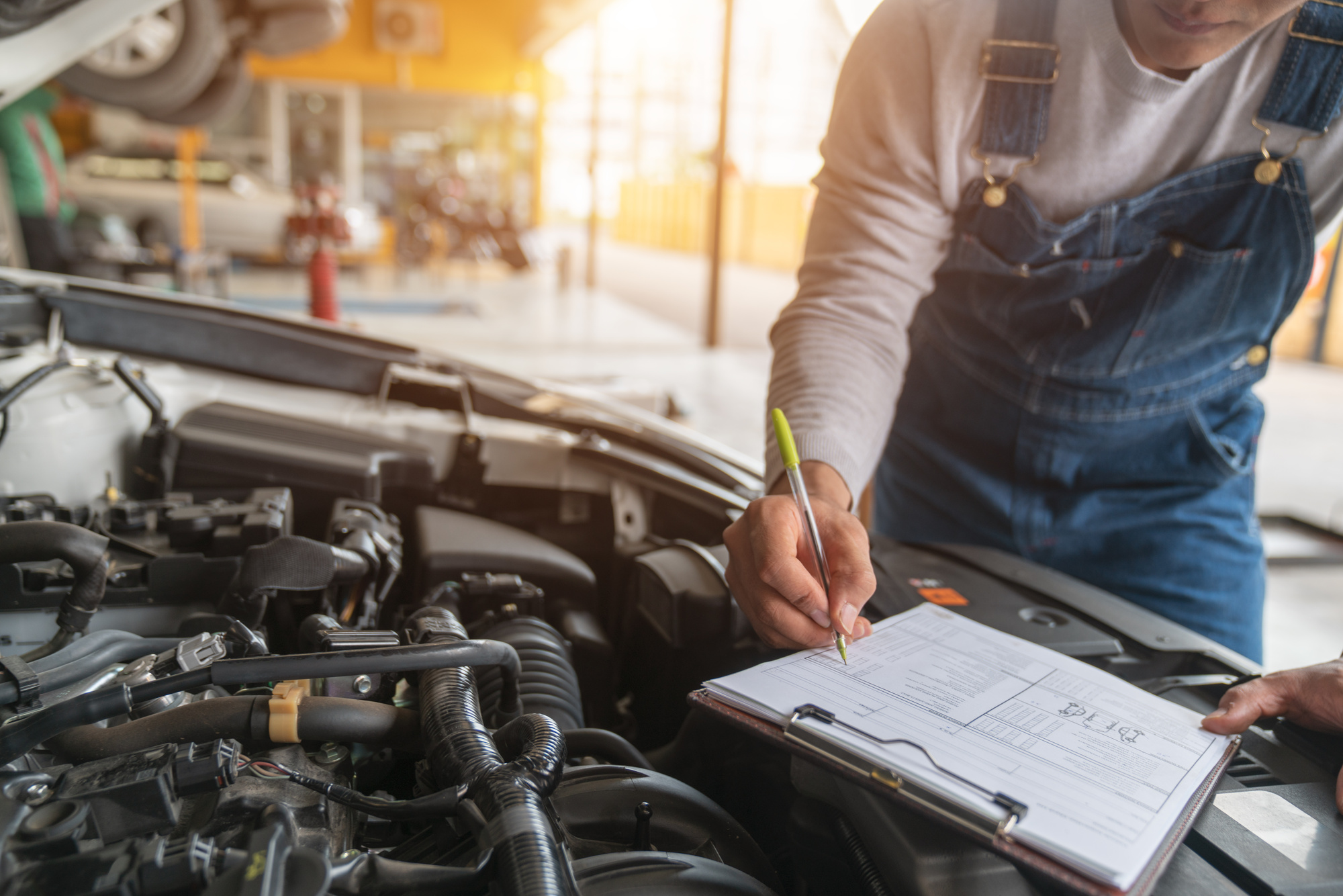 mechanic checking car