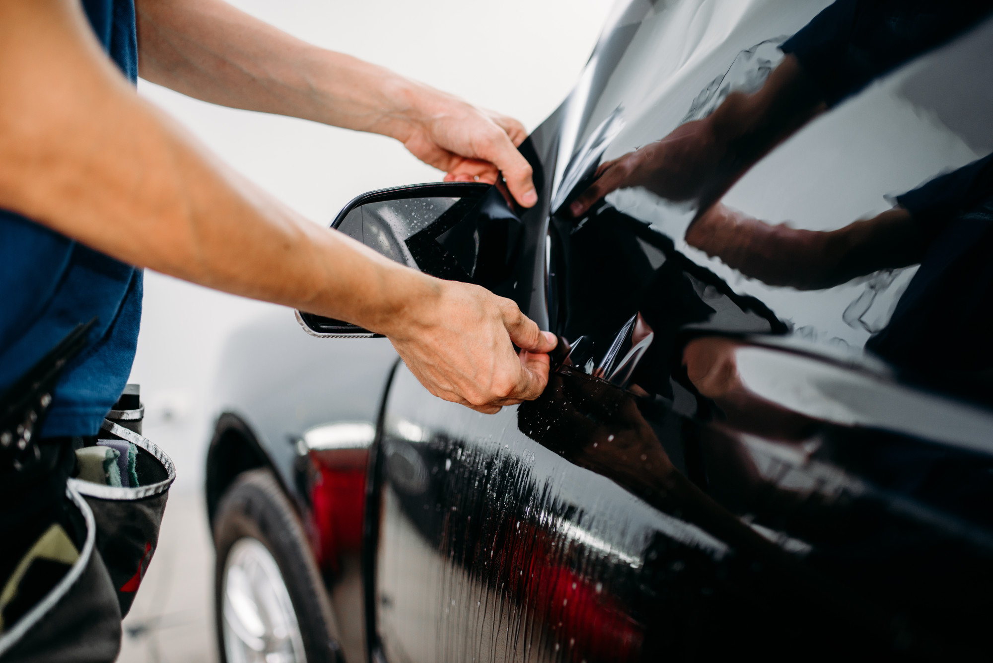 Person Applying Dark Tint